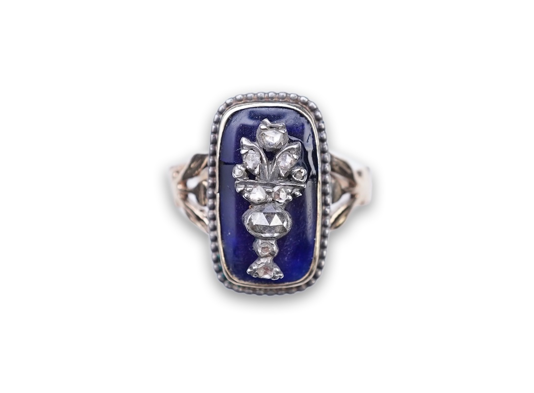 A diamond and blue glass ring